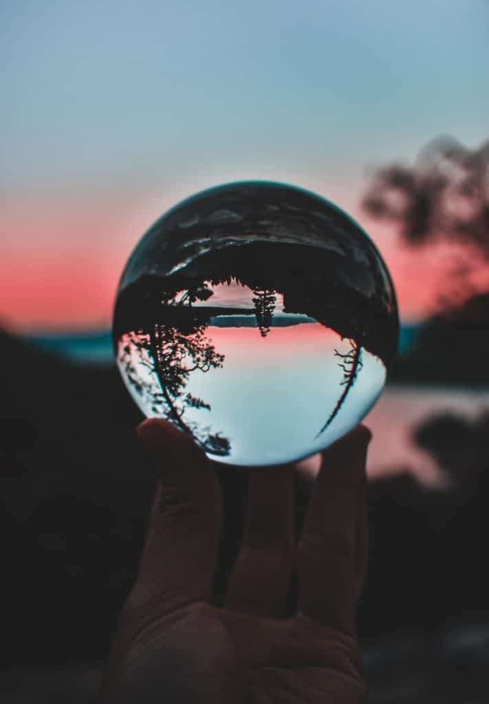 crystal ball reflecting a landscape 
