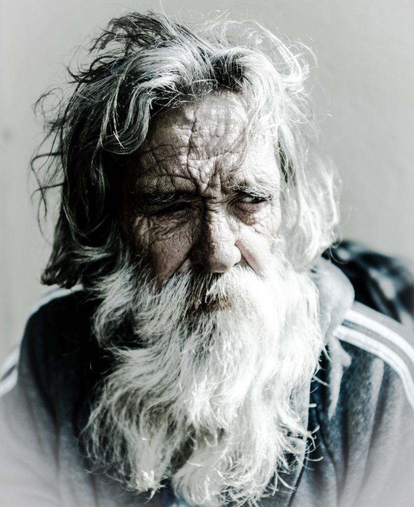 old man with a long beard representing a hermit 