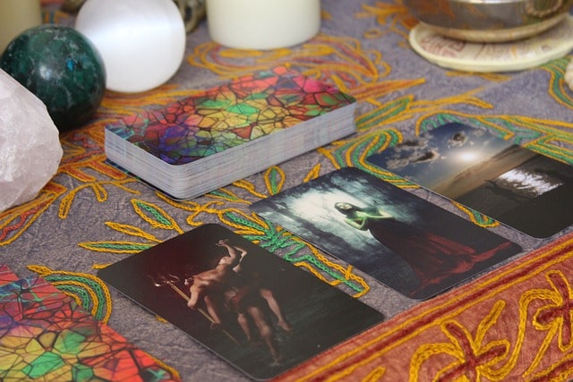 psychic is using a tarot deck