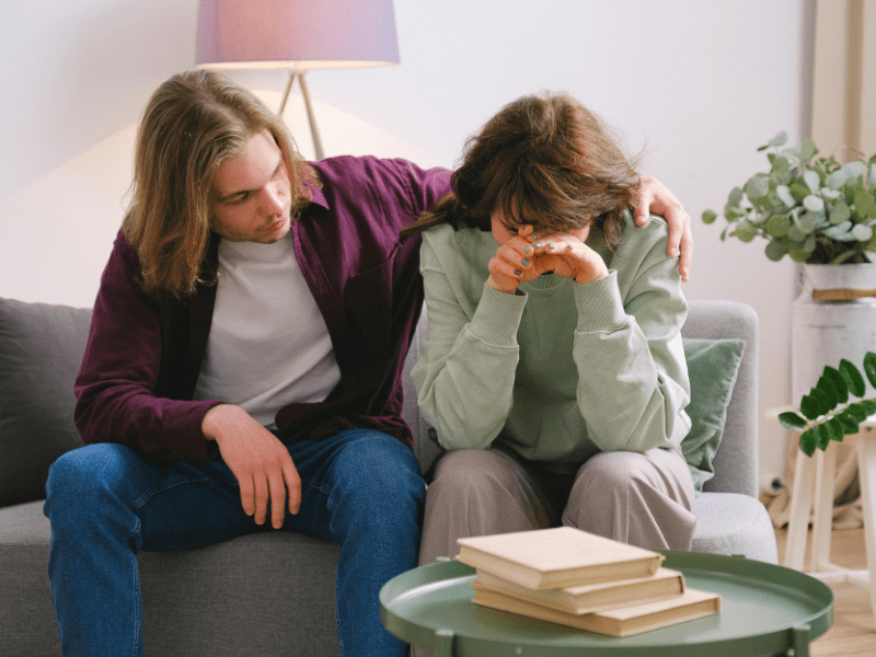 man comforting his woman