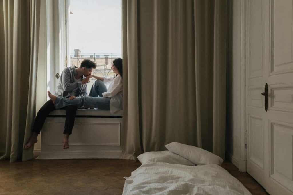man kissing the hand of his woman