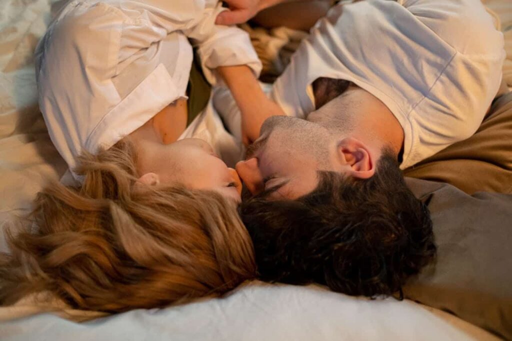 romantic couple lying on bed