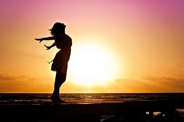 silhouette of woman enjoying freedom