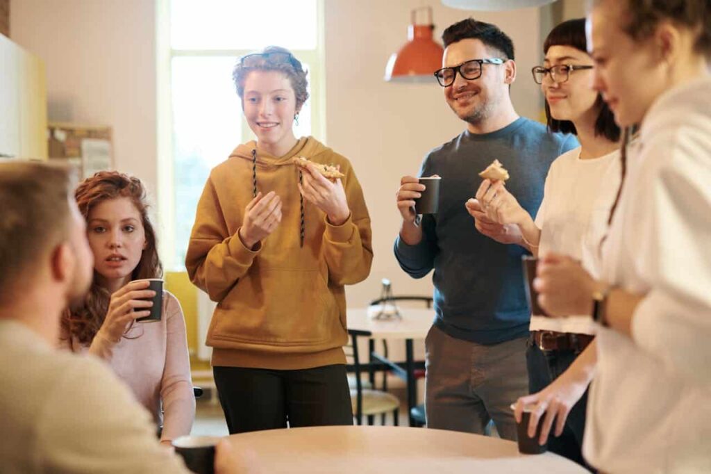 young man talking and his friends listening