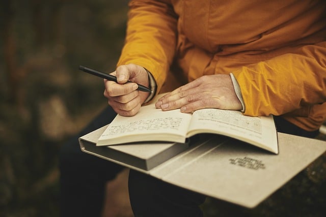 an adult writing a journal