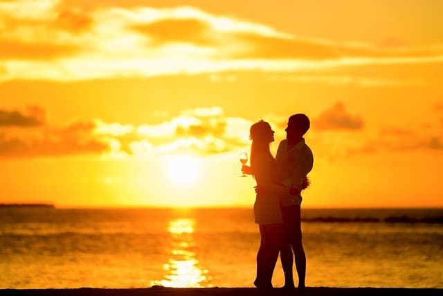 couple enjoying beach sunset