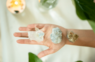crystals on a person's hand
