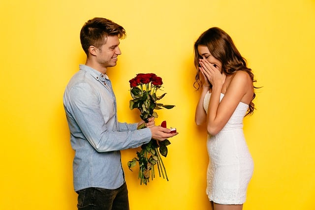 man handing flower to woman