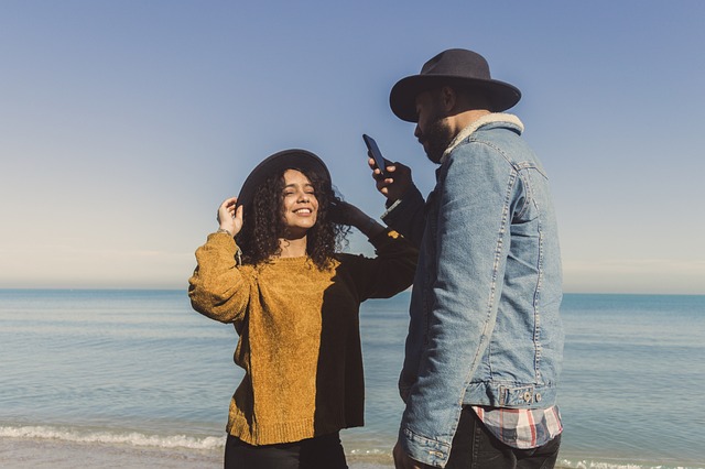 a couple standing on the beach