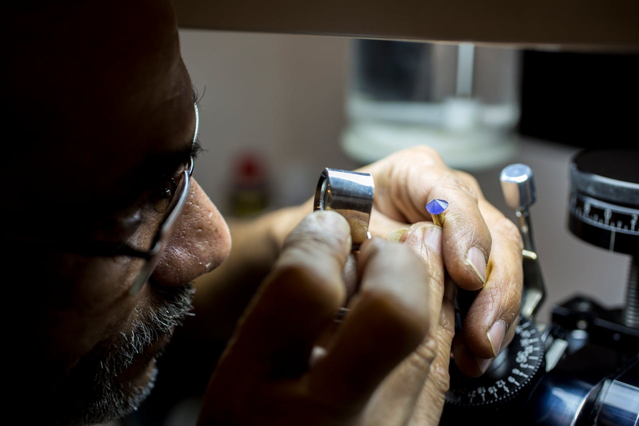 A man checking gemstones