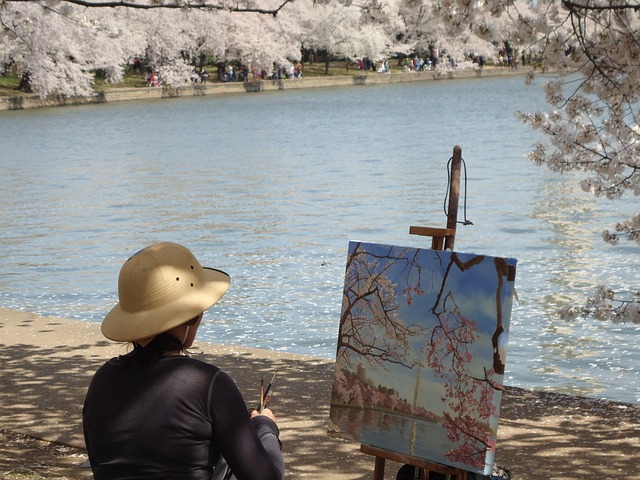 artist painting cherry blossoms