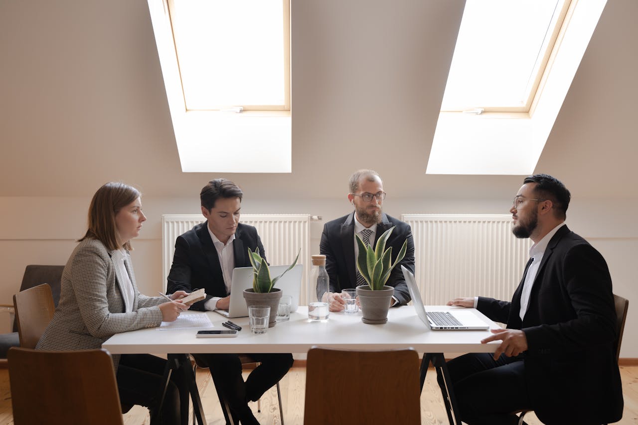 corporate individuals discussing at a meeting