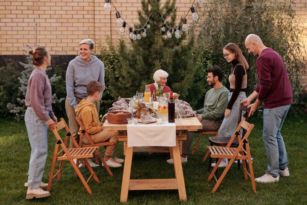 family gathered around a table in the yard