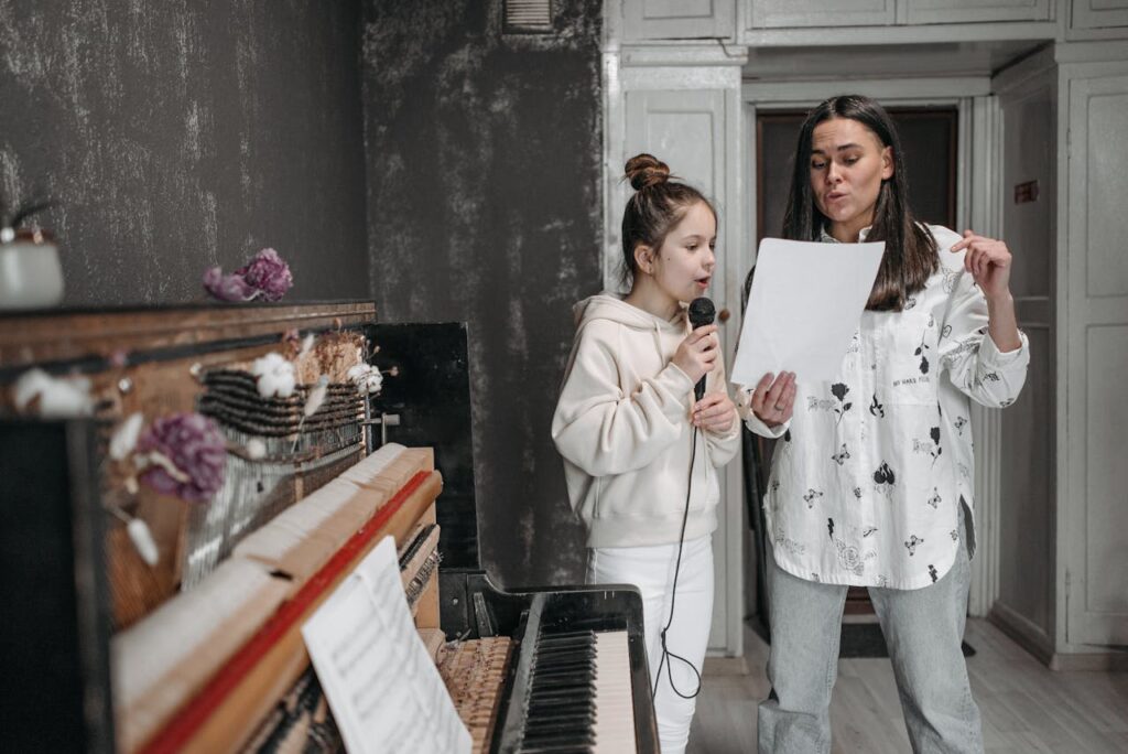 music instructor teaching a girl how to sing