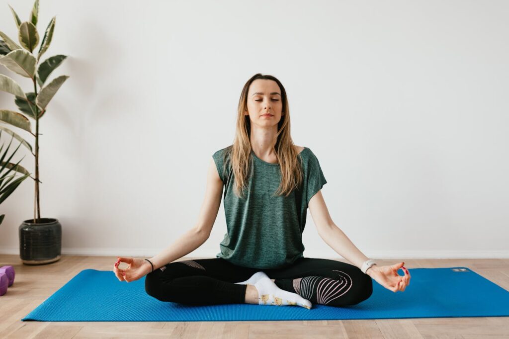 woman meditating on mat