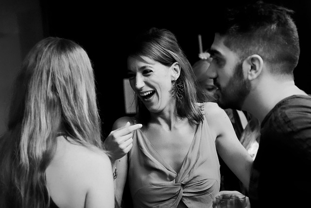 woman joyfully laughing with her friends