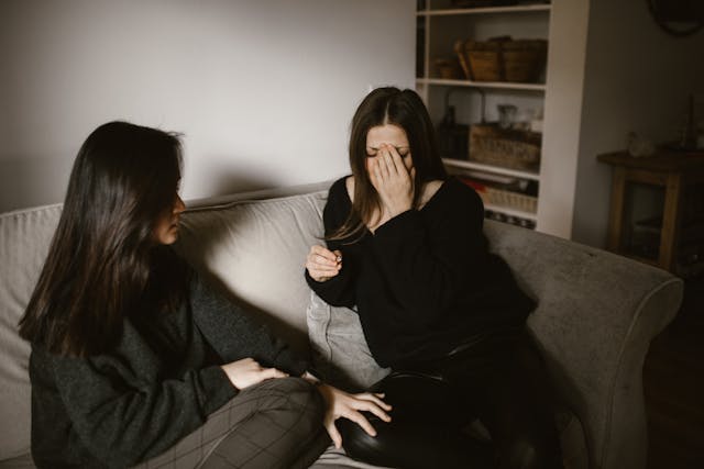 a woman empathizing with her friend