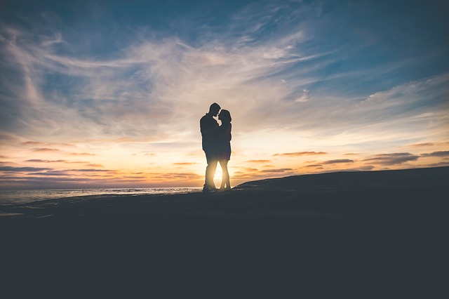 Romantic silhouette of a couple during sunset