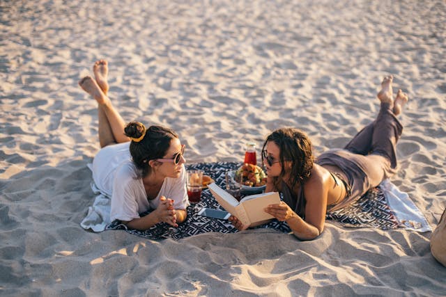 women talking on the beach
