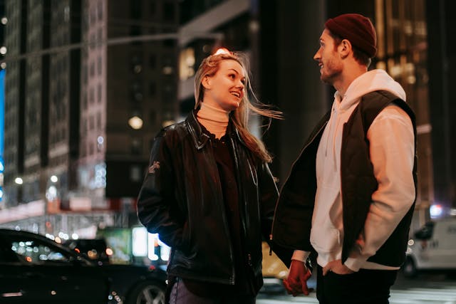 a couple having a conversation near the road