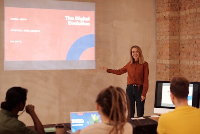 a woman presenting slides at work