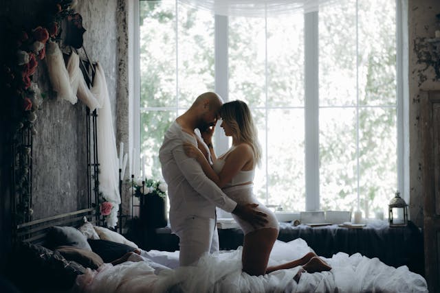 a couple sharing an intimate moment on the bed