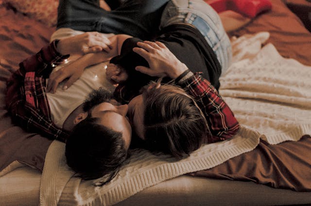 romantic couple lying on bed