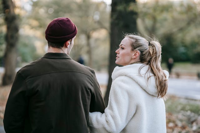 a couple having a conversation while walking