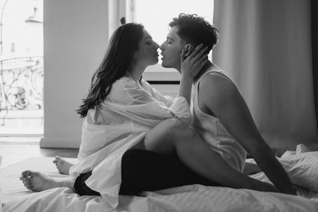 a couple having an intimate moment in bed