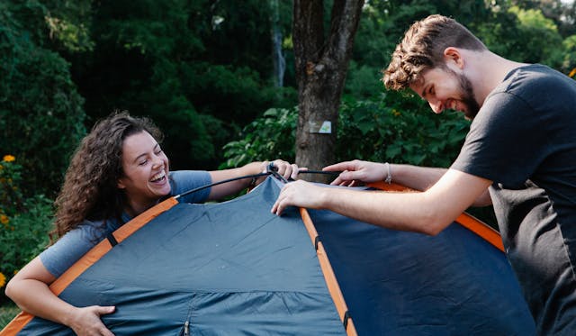a happy couple sharing an interest in camping