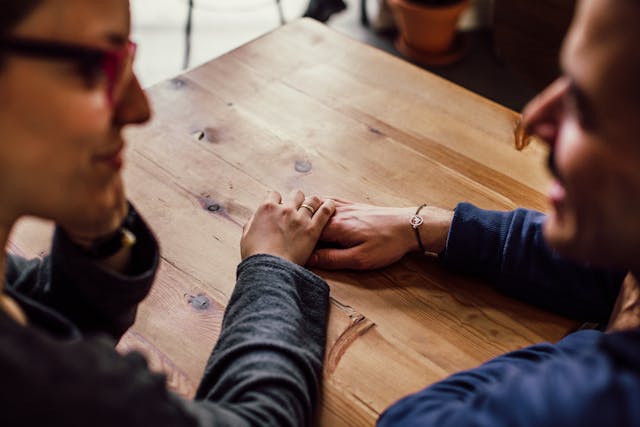 a woman giving advice to her man, reinforcing positivity
