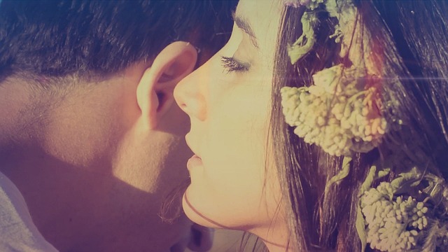 a woman is whispering a message to a man