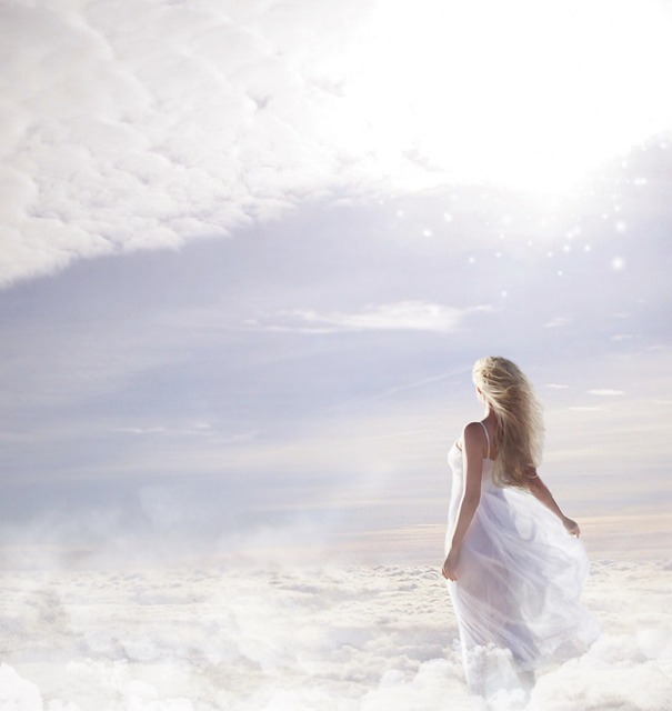 a young woman in a white dress stands joyfully on clouds, creating a dreamlike atmosphere