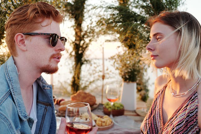 a couple talking and looking at each other