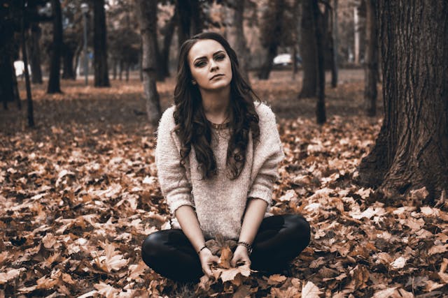photo of an emotional young woman in a forest